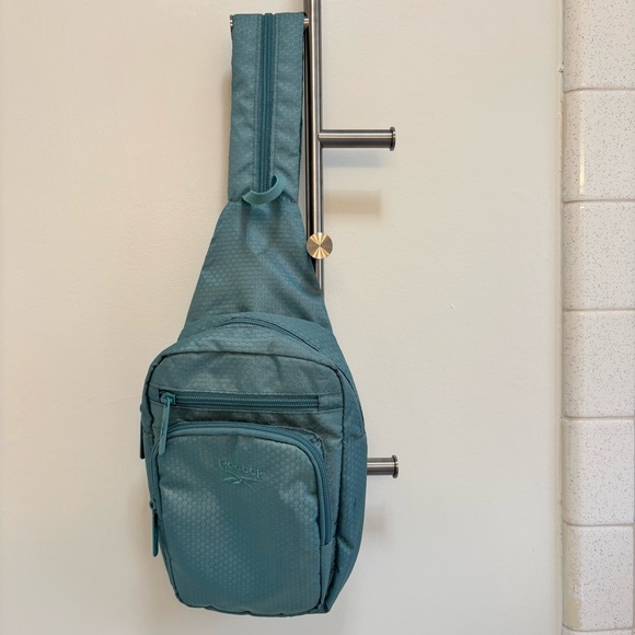 Reebok Handbags - Reebok Cosmos Crossbody Bag Sling Backpack